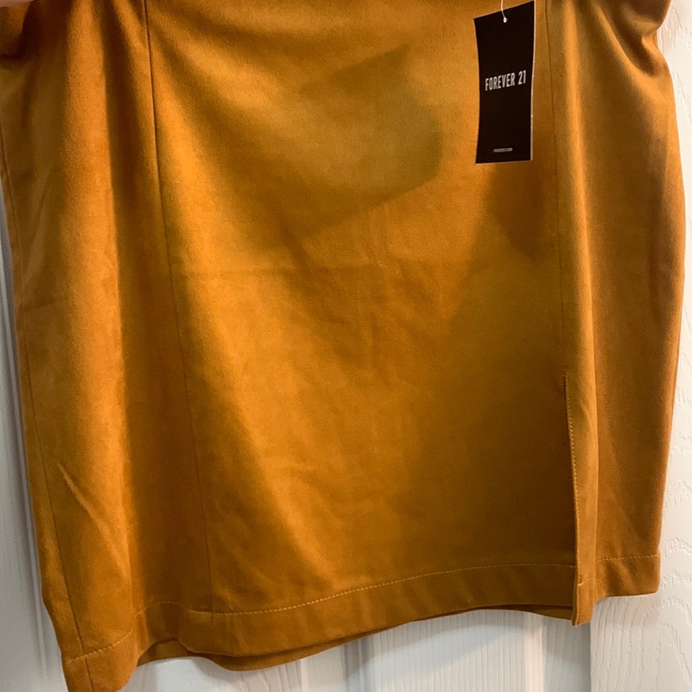 Brand new mustard skirt slit on the left side of leg brand new never worn